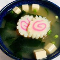 Space Miso Soup · Miso soup with fish cake, tofu, seaweed and chopped green onion.