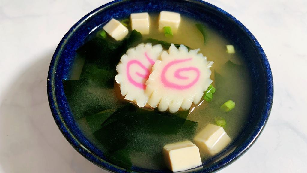 Space Miso Soup · Miso soup with fish cake, tofu, seaweed and chopped green onion.