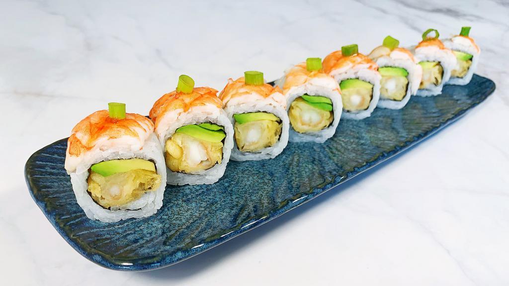 Tempura Tiger Roll · Eight pieces tempura shrimp avocado roll topped with shrimp, sweet chili sauce and green onion.