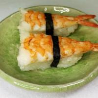 Aburi Ebi Nigiri · Two pieces seared shrimp over sushi rice.