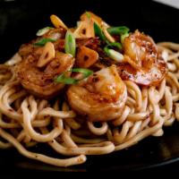 Garlic Noodles · Buttery garlic noodles infused with an original blend of soy sauce and spices, sprinkled wit...