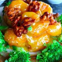 Walnut Shrimp (Dinner) · Seven breaded jumbo shrimp sauteed with carrots, peas in a creamy, and sweet white sauce. To...