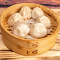 Xiao Long Bao Shanghai Style Soup Dumplings (Dinner) · Steamed dumplings filled with pork and green onion. Served in a bamboo steamer with a side o...