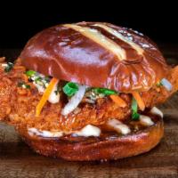 Honolulu Hot Chicken · Chef Logan Sandoval’s Honolulu  Hot Chicken features a crispy hot chicken tender, topped wit...