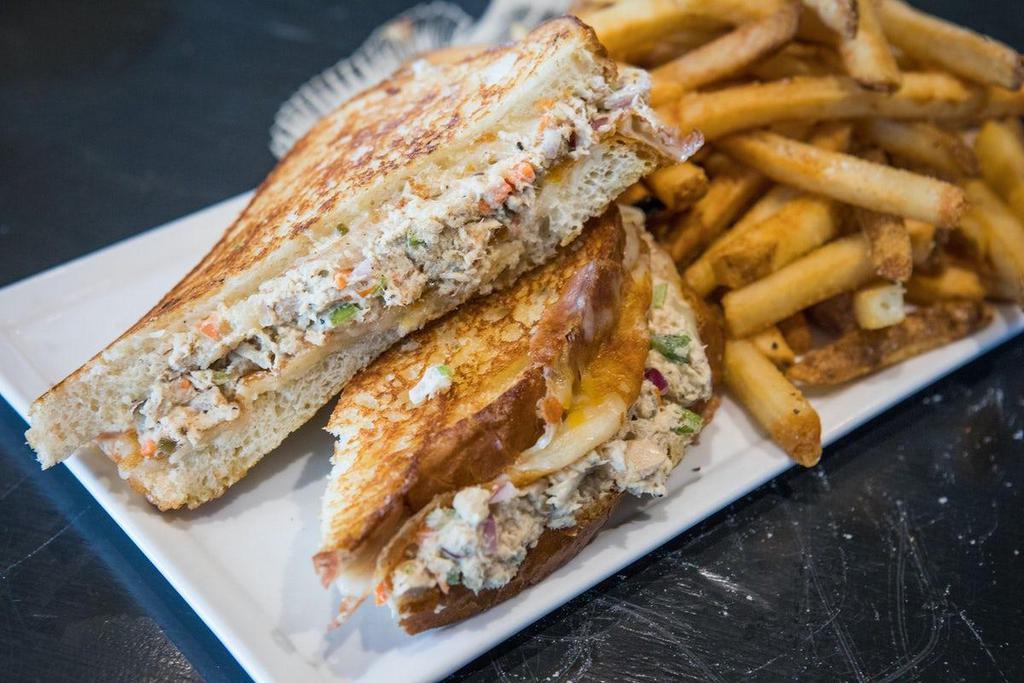 Tuna Melt · Our Signature tuna salad melted cheddar cheese served on grilled sourdough bread.