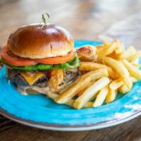 Brisket Burger · A chargrilled brisket & angus chuck blend patty, smoked bacon, aged cheddar, sliced tomato, ...