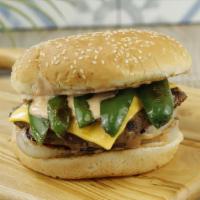 Jalapeño Burger · 100% pure ground beef flame-broiled patty topped with fresh serrano jalapenos, crisp iceberg...