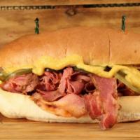 Pastrami Sandwich · Cured to perfection tender and juicy pastrami topped with crunchy pickles and tangy mustard ...