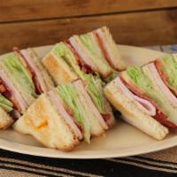 Club Sandwich · Thinly sliced deli-style turkey topped with crisp hickory smoked bacon, fresh lettuce, and s...