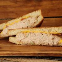 Tuna Melt · Fresh tuna topped with gooey cheese and grilled on sourdough bread.