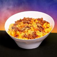 Pulled Pork Mac And Cheese · Elbow noodles in a creamy cheese sauce with pulled pork, bbq sauce, and scallions