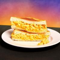 Mac And Cheese Melt Sandwich · Classic mac and cheese on toasted white bread.