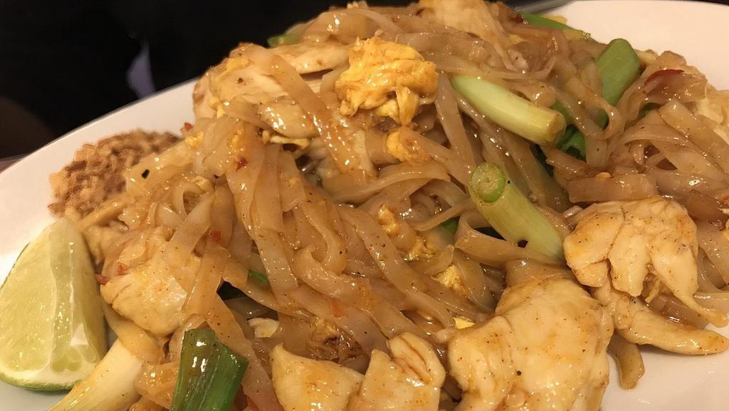 Pad Thai · Pan fried rice noodles with egg, bean sprouts, sweet tamarind sauce and green onion served with ground peanuts and lime slice on the side.