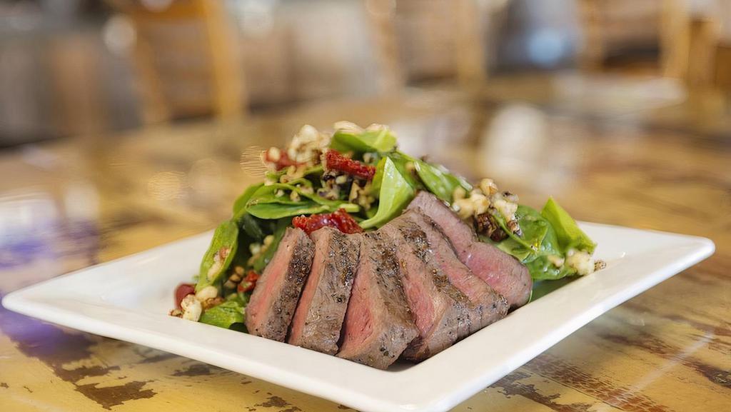 Spinach & Steak Salad · Top sirloin steak, spinach, toasted walnuts, oven-dried tomatoes, stilton blue cheese, poppy seed dressing.

Consuming raw or undercooked meats, poultry, seafood, shellfish, or eggs may increase your risk of food-borne illness, especially if you have certain medical conditions.