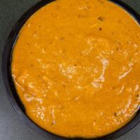 Chicken Tikka Masala · Boneless chicken tandoori pieces in tangy tomato and cream sauce with exotic herbs and spices.