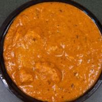 Butter Chicken · Grilled boneless chicken pieces cooked in tangy tomato and onion gravy.