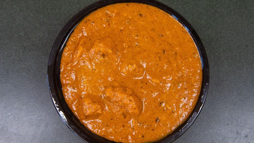 Butter Chicken · Grilled boneless chicken pieces cooked in tangy tomato and onion gravy.