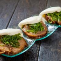 Chasu Pork Bun(3Pcs) · Marinated pork belly with a hint of garlic and green onion wrapped in soft rice buns.