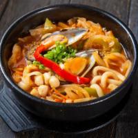 Spicy Seafood Udon · Chicken based broth soup with Japanese thick noodles and shrimp, squid, and mussels.