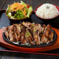Chicken Teriyaki · Grilled chicken with house-made teriyaki sauce. Served with rice, and salad.