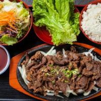 Bulgogi · Korean style marinated beef. Served with rice, and salad.