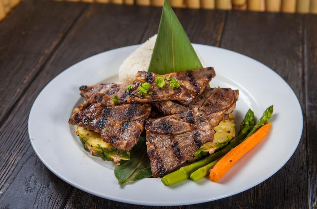 Kalbi · Korean BBQ short ribs. Served with  rice, and salad.