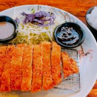 Tonkatsu · Breaded pork cutlet with katsu sauce. Served with rice, and salad.
