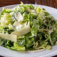 Caesar · Romaine lettuce, shaved parmesan cheese and Caesar dressing.