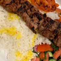 Beef Kabob · Marinated & grilled Sirloin Kabob chunks served over Basmati rice and a side of chopped cucu...