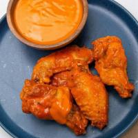 Buffalo Wings · Coated with a vinegar-and-cayenne-pepper hot sauce mixed with butter