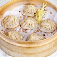 Juicy Pork Soup Dumpling - Xiao Long Bao · 小龍包. 6 Juicy Pork Dumplings.  . Remember, don't put it in your mouth.  Grab your soup spoon ...