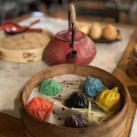 The Magnificent Six - Sampler Of 6 Colors Of Xiao Long Bao · 六位武俠. Sampling of all six of our colored soup dumplings - Yellow Chicken, Blue Cuttlefish & ...