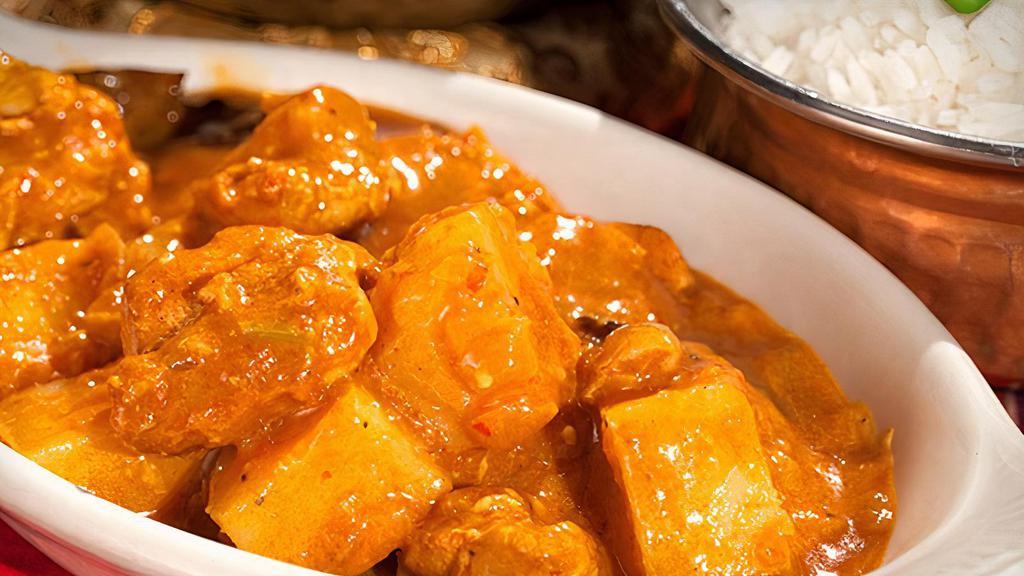 Chicken Vindaloo · Gluten-free. Boneless thigh chicken cooked with potatoes, onions, tomatoes, vinegar and spices in a tangy sour sauce. Served mild, medium or hot with a side of basmati rice, brown rice or naan.