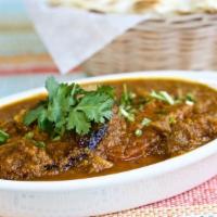 Goat Curry · with bone in goat pieces cooked in Himalayan special sauce with different herbs and spices.