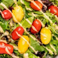 Mixed Greens Salad · Mixed fields greens, heirloom cherry tomatoes, EVOO, white balsamic dressing, salt & pepper.