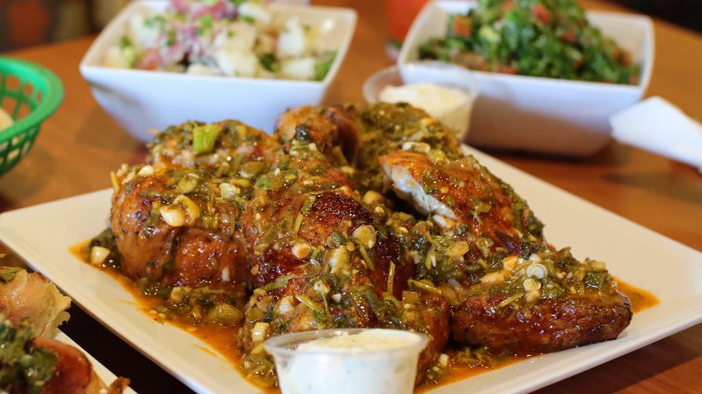 Whole Spicy Chicken · A whole rotisserie chicken along our signature spicy lemon garlic sauce elevates your taste buds to a mediterranean dream. Served with your choice of two sides.