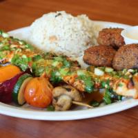 Spicy Chicken And Vegetable Kabob · Juicy chicken breast marinated in our spicy lemon garlic sauce. Served with your choice of t...