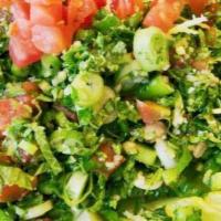 Lg Tabouleh Salad · Finely chopped parsley, tomatoes, green onions, bulgar, and fresh mint, tossed with fresh sq...