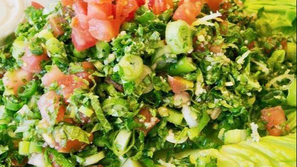 Lg Tabouleh Salad · Finely chopped parsley, tomatoes, green onions, bulgar, and fresh mint, tossed with fresh squeezed lemon juice and extra virgin olive oil.