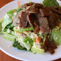 Gyro Salad · Romaine lettuce, tomatoes, cucumbers, red onions, and red bell peppers, tossed with freshly ...