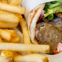 Spicy Gyro Sandwich · Tender and juicy gyro hot off the spit, topped with lettuce, tomatoes, onions, and tzatziki ...
