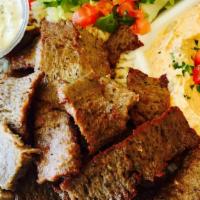 Gyro Plate · Tender, juicy gyro, and hot off the spit on a bed of Maison rice. Served with hummus, green ...