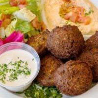 Falafel Plate · 7 falafels with a side of hummus, green salad, and pickled turnips. Served with tahini sauce...