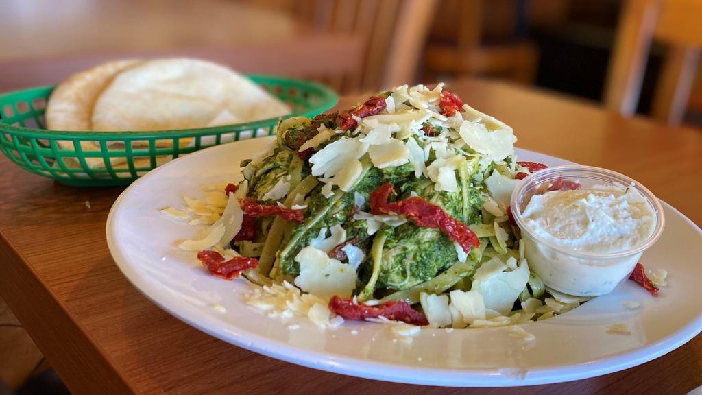 Fettuccine Pesto · Chicken, sundried tomatoes, basil, and topped with fresh parmesan.