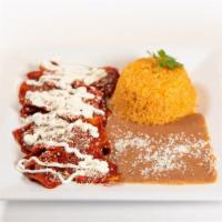 Chilaquiles · Corn tortillas fried over green or red sauce with a side of rice and beans.