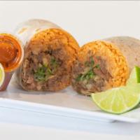 Burrito · Flour tortilla, rice, beans , choice of meat and onions and cilantro.