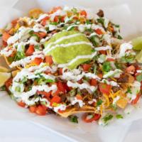 Nachos · Fried tortilla chips, beans, choice of meat, pico de gallo, cheese, sour cream, and guacamol...