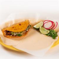 Quesabirria · Handmade  tortilla with cheese and shredded barbacoa de res meat.