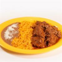 Barbacoa De Res · Shredded beef with rice & beans or in a soup.