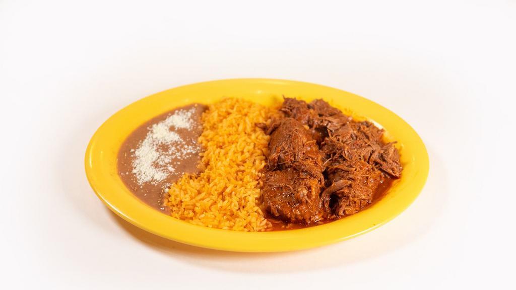 Barbacoa De Res · Shredded beef with rice & beans or in a soup.